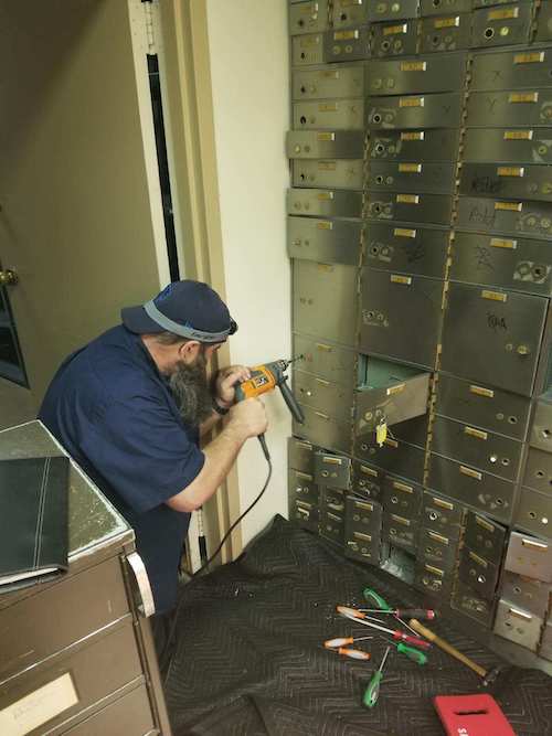 safe locksmith drilling a safe in Chicago IL bank.
